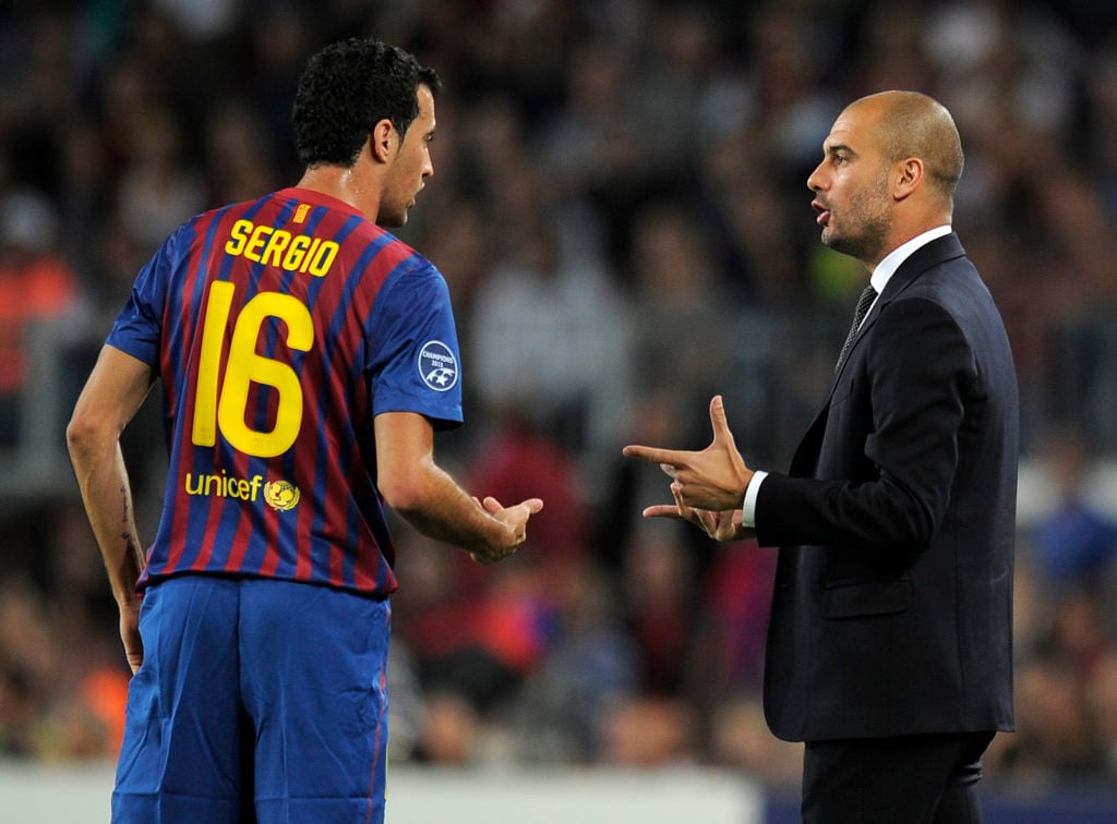 Barcelona's coach Josep Guardiola (R) ta