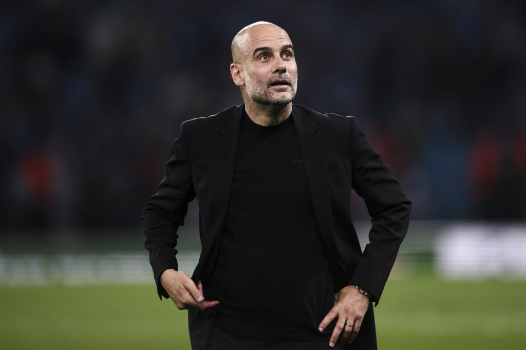 Pep Guardiola, head coach of Manchester City FC, looks on