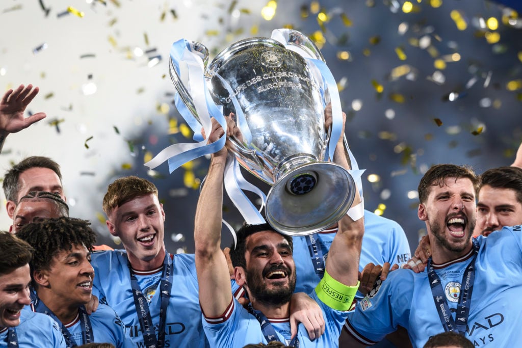 Ilkay Gundogan (C) of Manchester City FC lifts the trophy as