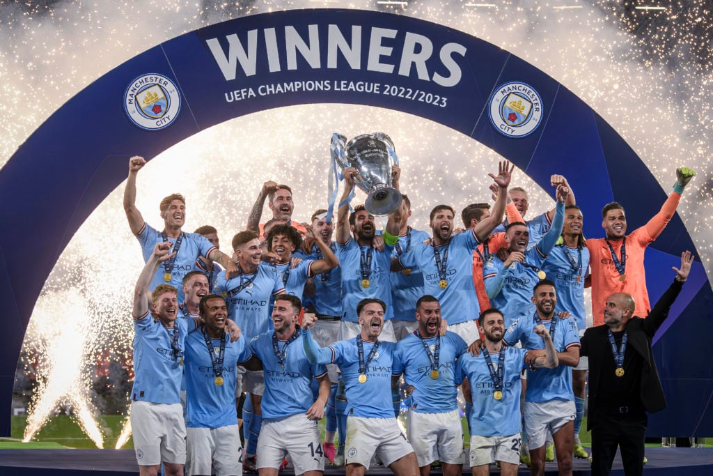 Ilkay Gundogan (C) of Manchester City FC lifts the trophy as