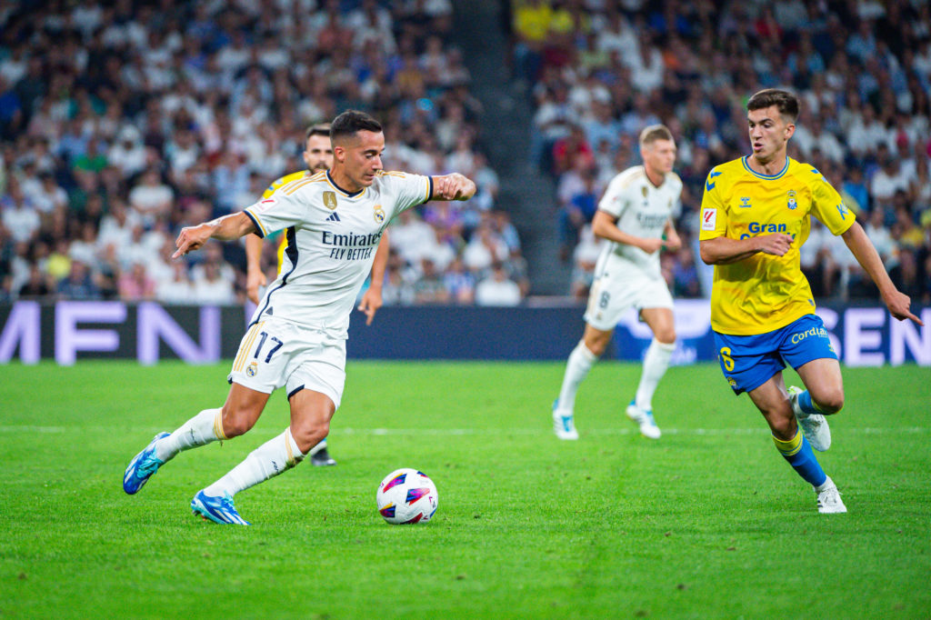 Lucas Vazquez (Real Madrid) (L) in action against Maximo