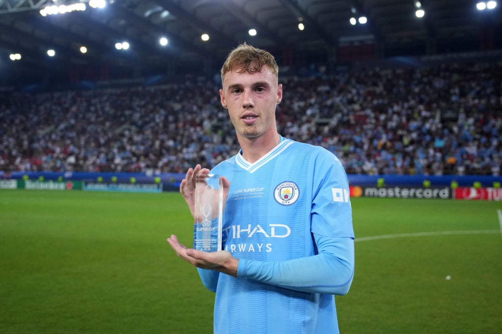 Cole Palmer holding the Player of the Match award after Manchester City vs Sevilla