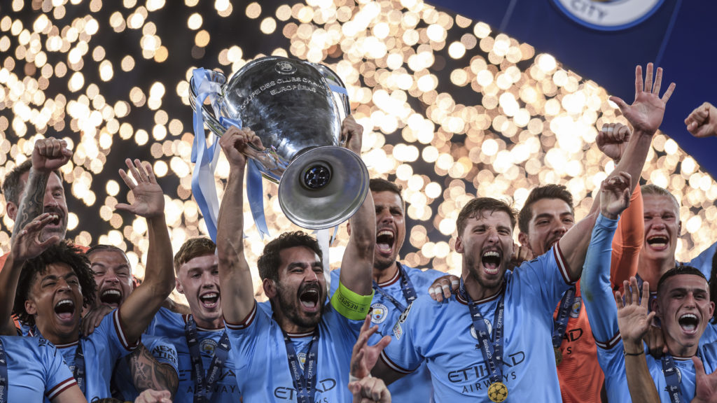Ilkay Gundogan (C) of Manchester City FC lifts the trophy as