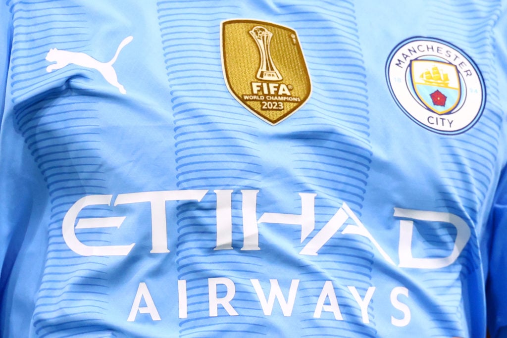 The FIFA World Club Champions badge is seen on the shirt of Manchester City during the Premier League match between Manchester City and Sheffield United at Etihad Stadium on December 30, 2023