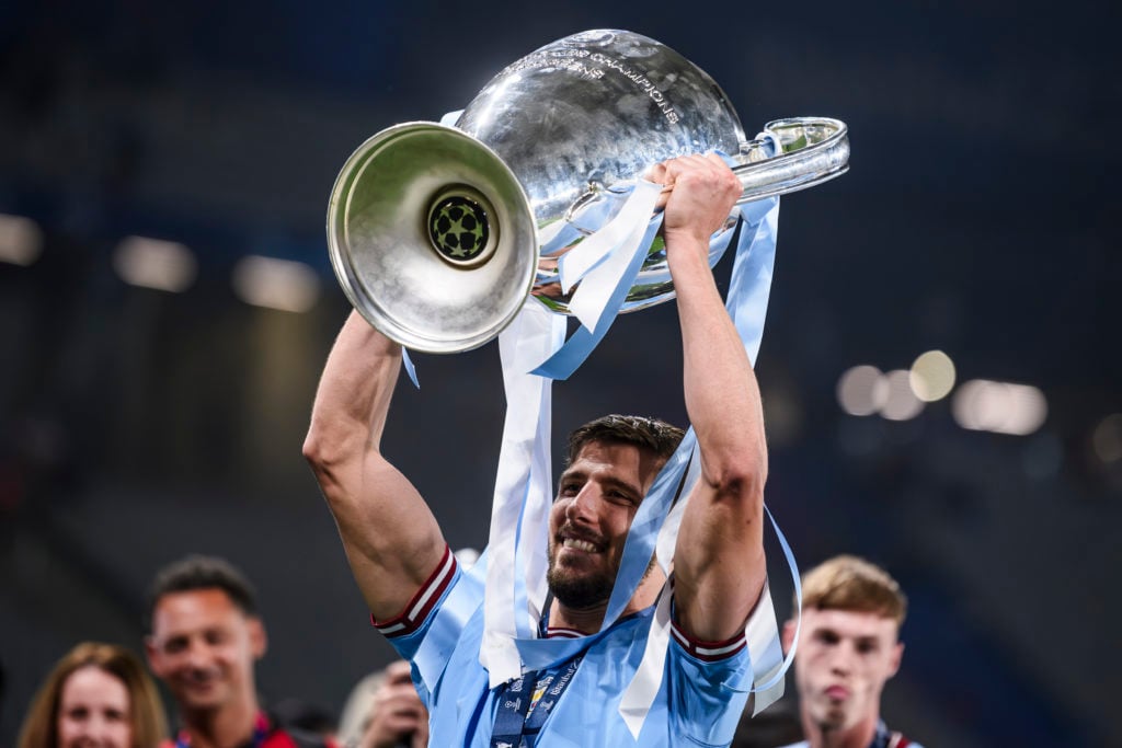 Ruben Dias of Manchester City FC celebrates with the trophy