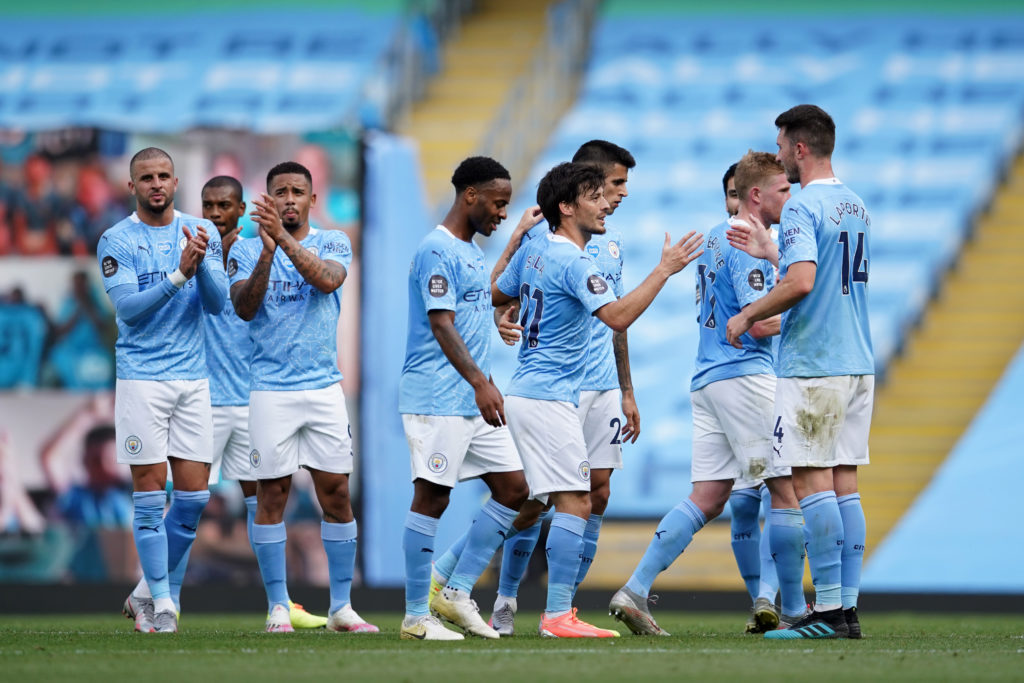 David Silva of Manchester City is congratulated by teammates as he comes off during his last game for Manchester City during the Premier League match between Manchester City and Norwich City at Etihad Stadium on July 26, 2020