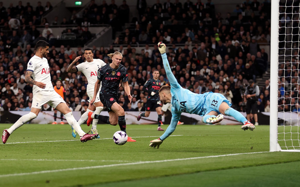 Guglielmo Vicario of Tottenham Hotspur fails to save a cross from Kevin De Bruyne of Manchester City (not pictured) before Erling Haaland of Manchester City scores his team's first goal during the Premier League match between Tottenham Hotspur and Manchester City at Tottenham Hotspur Stadium on May 14, 2024 in London, England.