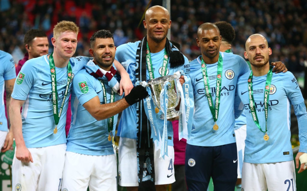 Kevin De Bruyne, Sergio Aguero, Vincent Kompany, Fernandinho and David Silva posing with the Carabao Cup trophy