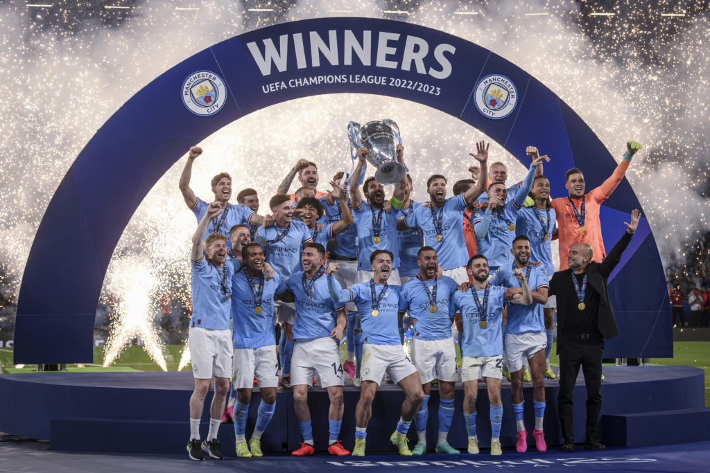 Ilkay Gundogan (C) of Manchester City FC lifts the trophy as