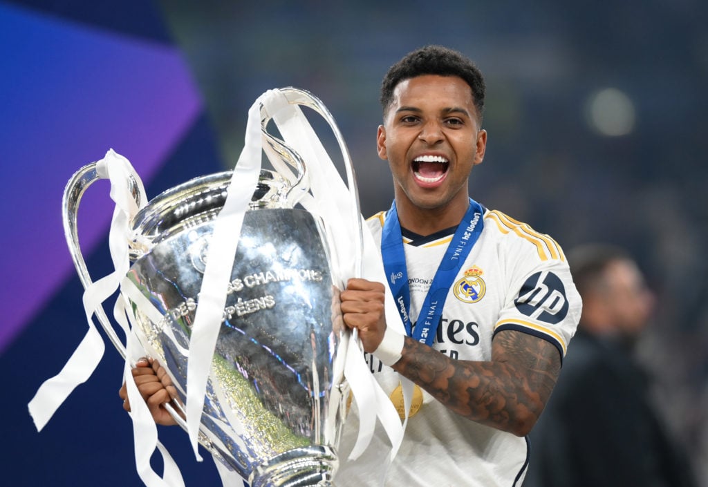 Rodrygo Goes of Real Madrid holding the UEFA Champions League trophy