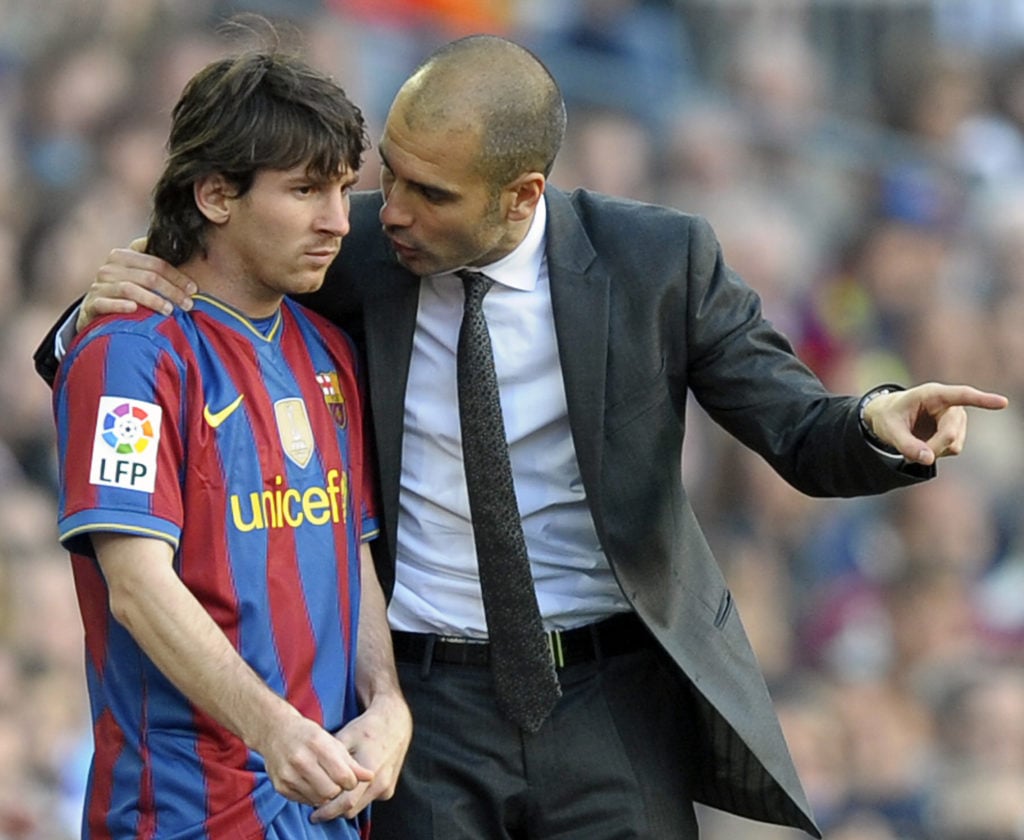 Barcelona's coach Pep Guardiola (R) talk