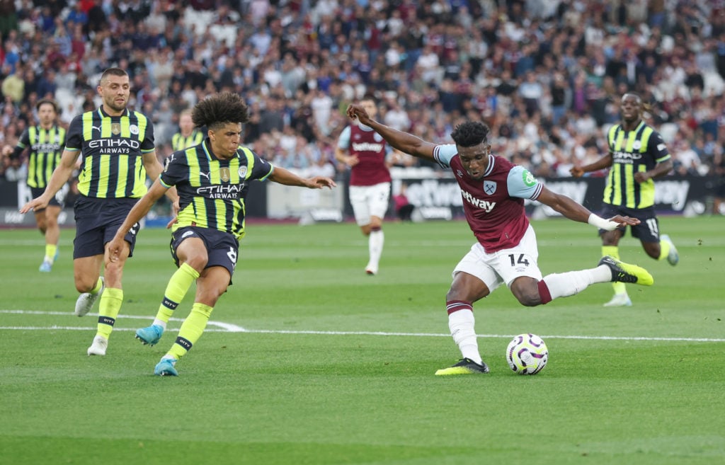Mohammed Kudus and Rico Lewis in action during West Ham United v Manchester City