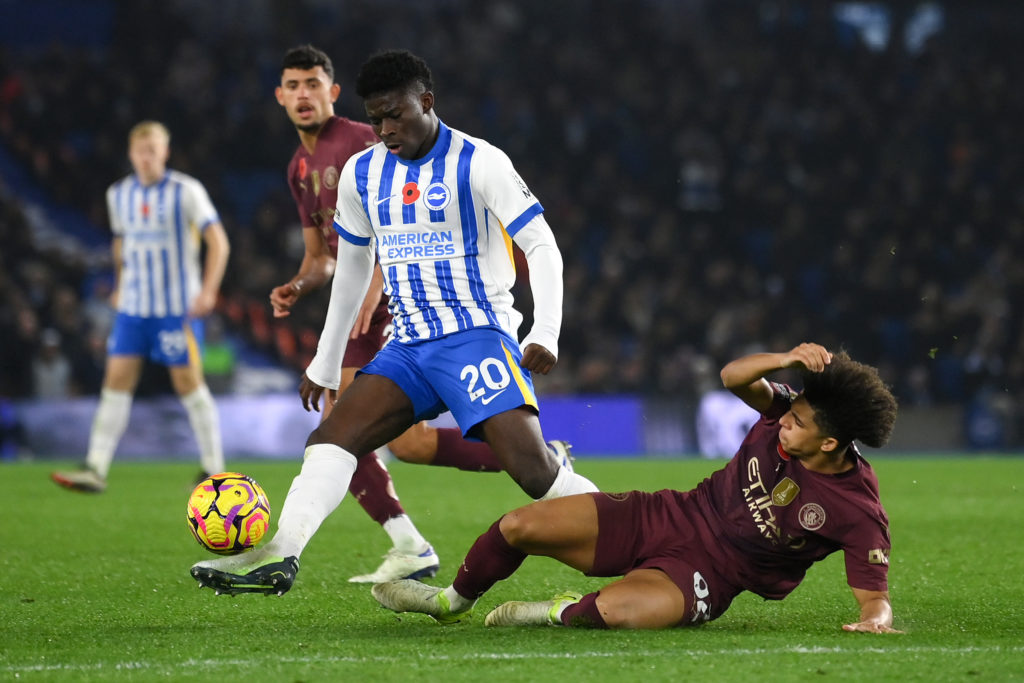 Carlos Baleba being tackled by Rico Lewis during Brighton vs Manchester City