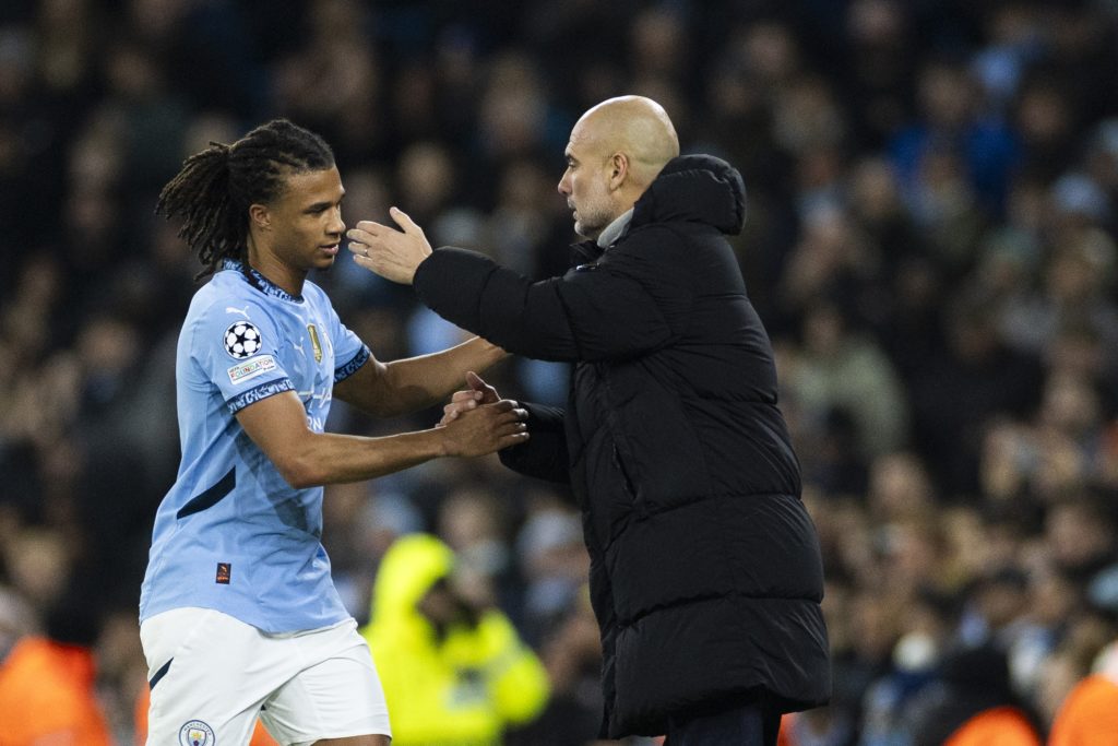 Man City's Pep Guardiola and Nathan Ake