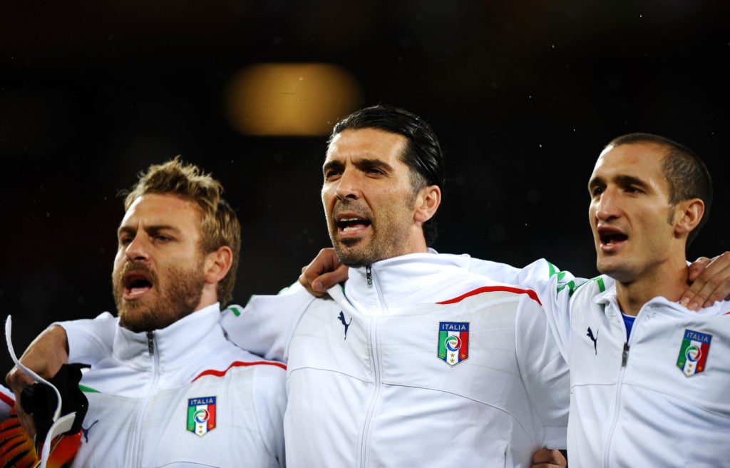 Daniele De Rossi, Gianluigi Buffon and Giorgio Chiellini of Italy sing the national anthem before the 2010 FIFA World Cup South Africa Group F match between Italy and Paraguay at Green Point Stadium on June 14, 2010