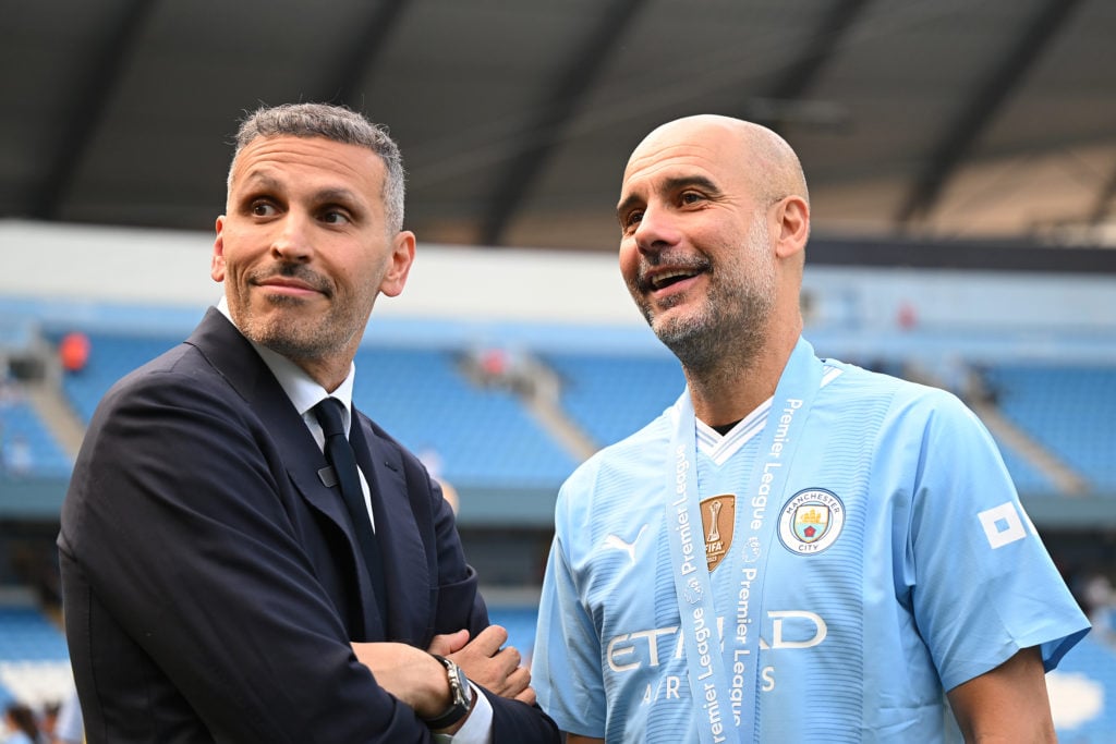 Khaldoon Al Mubarak, Chairman of Manchester City, and Pep Guardiola, Manager of Manchester City, watch on following the team's victory in the Premier League match between Manchester City and West Ham United at Etihad Stadium on May 19, 2024