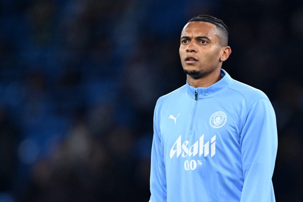 Manuel Akanji warming up ahead of Manchester City v Feyenoord Rotterdam.