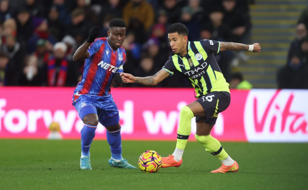 Marc Guehi defending against Savinho during Crystal Palace vs Manchester City