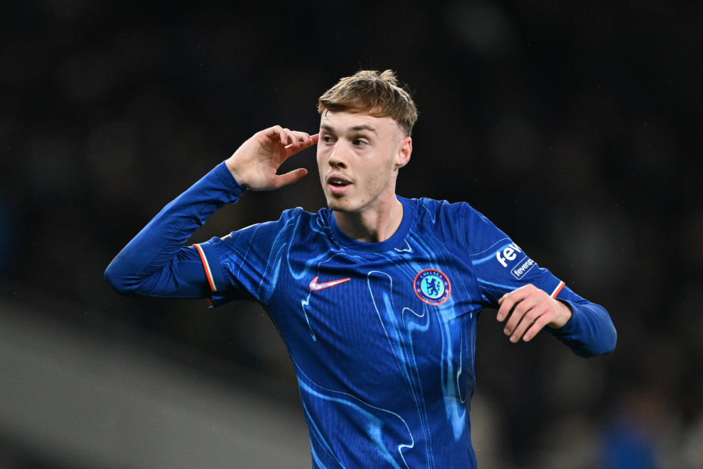 Cole Palmer with his hand on his ear during Tottenham Hotspur vs Chelsea