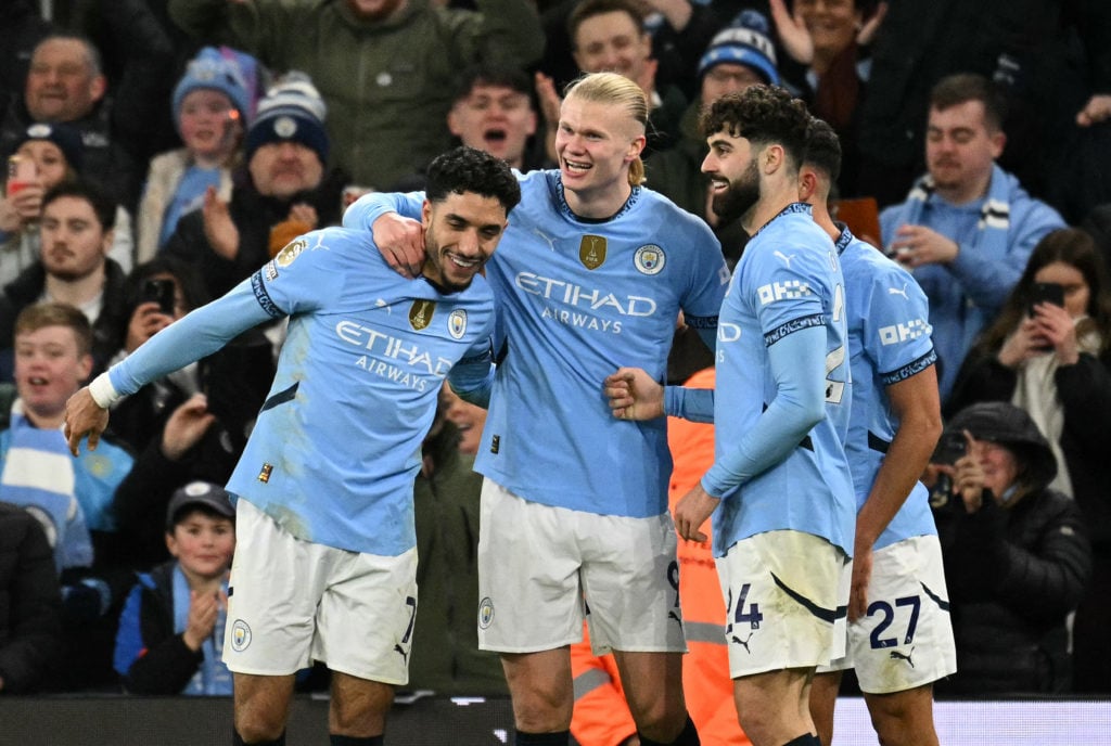 Manchester City's Norwegian striker #09 Erling Haaland celebrates scoring the team's second goal with Manchester City's Egyptian striker #07 Omar Marmoush (L) and Manchester City's Croatian defender #24 Josko Gvardiolduring the English Premier League football match between Manchester City and Chelsea at the Etihad Stadium in Manchester, north west England, on January 25, 2025.