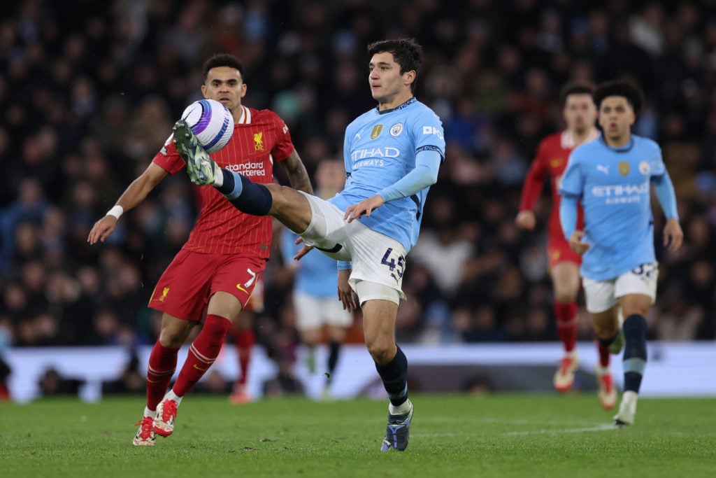 Abdukodir Khusanov and Luis Diaz in action during Manchester City and Liverpool