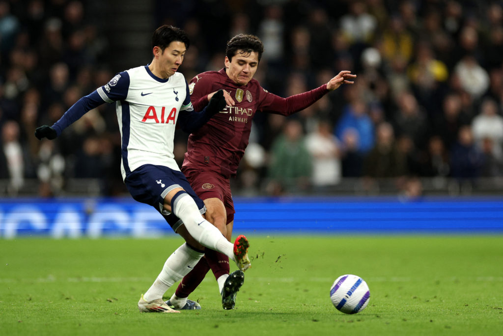 Son Heung-min and Abdukodir Khusanov in action during Tottenham Hotspur vs Manchester City