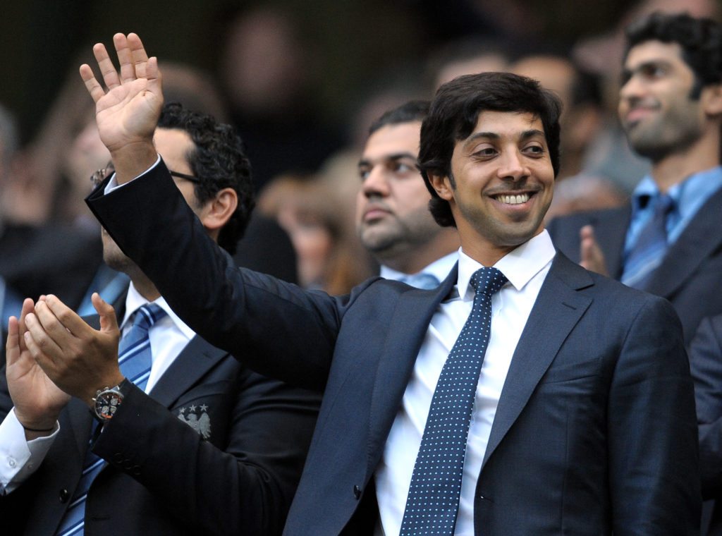 Manchester City owner Sheikh Mansour waving at the fans