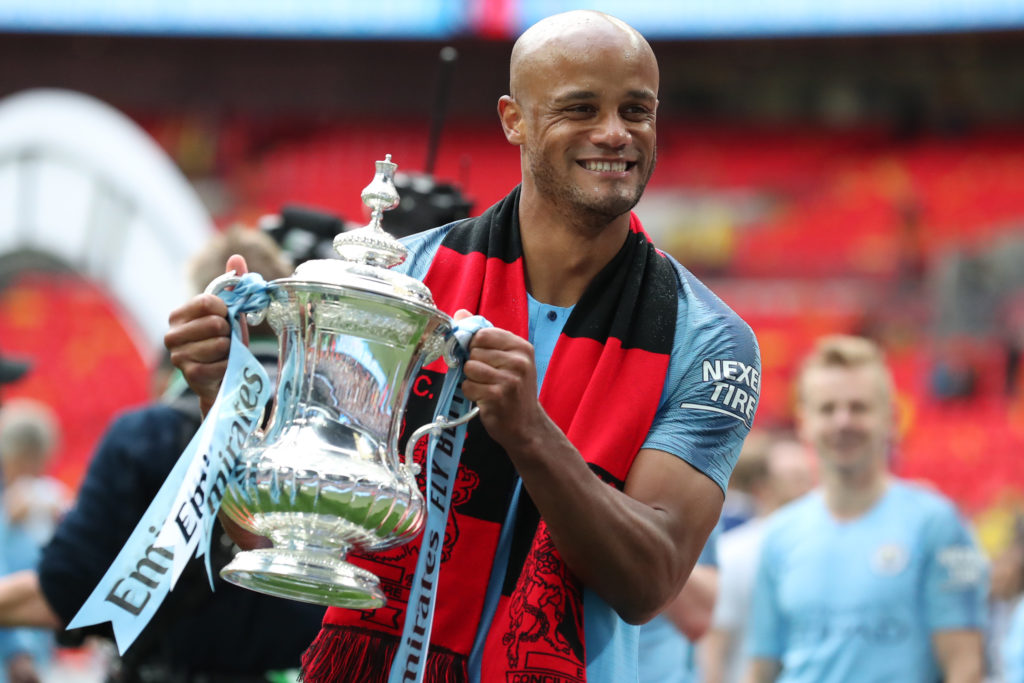 Vincent Kompany celebrates with the FA Cup during the FA Cup Final between Manchester City and Watford at Wembley Stadium, London on Saturday 18th May 2019.
