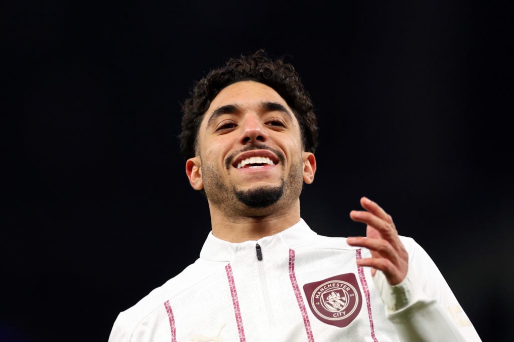 Omar Marmoush smiling for Manchester City.