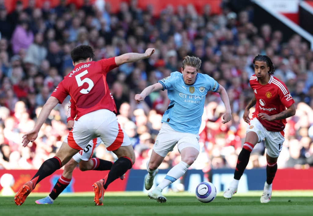Leny Yoro, Kevin De Bruyne and Harry Maguire in action during Manchester United v Manchester City