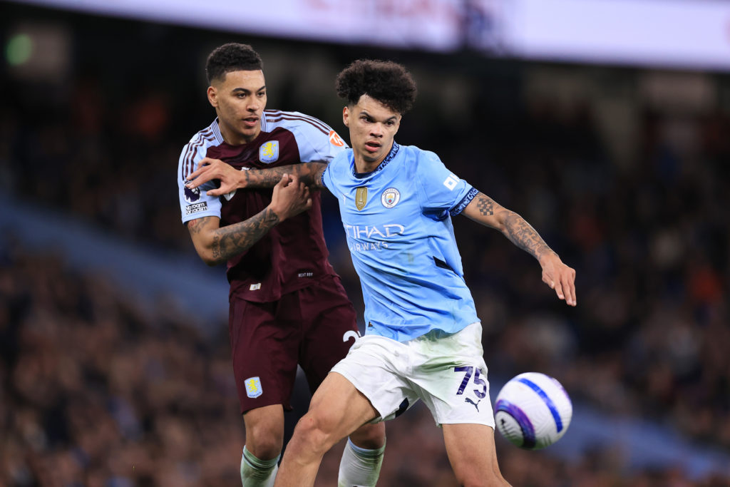 Morgan Rogers of Aston Villa battles with Nico O'Reilly of Manchester City during the Premier League match between Manchester City FC and Aston Villa FC at Etihad Stadium on April 22, 2025