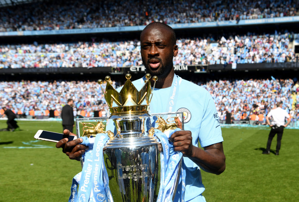 Man City legend Yaya Toure with the Premier League trophy.