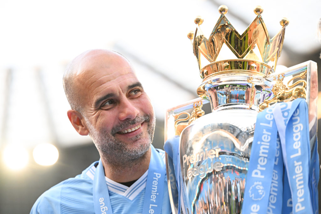 Pep Guardiola with the Premier League trophy.