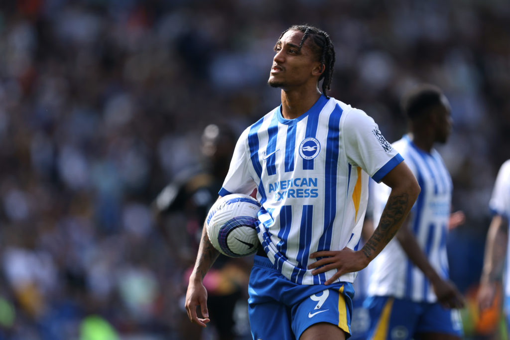 Joao Pedro of Brighton with a ball under his arm.