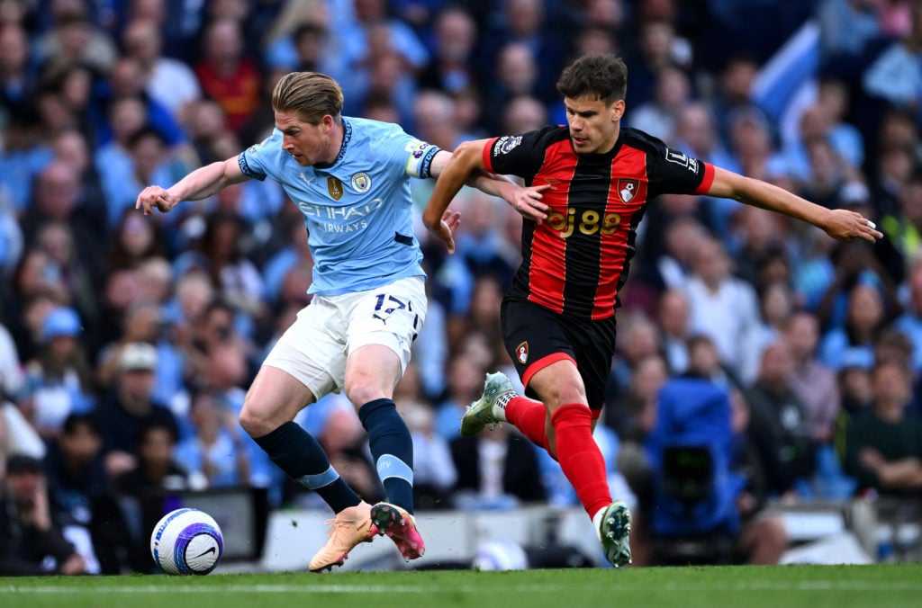 Kevin De Bruyne of Manchester City controls the ball whilst under pressure from Milos Kerkez of AFC Bournemouth