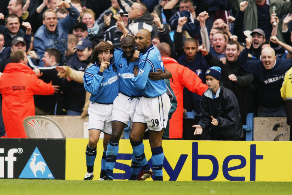 Shaun Goater of Manchester City celebrates his goal with team-mates Eyal Berkovic and Nicolas Anelka