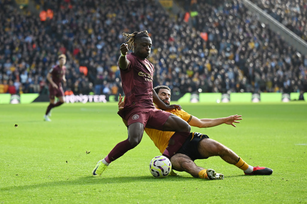 Rayan Ait-Nouri slides in on Jeremy Doku during Man City vs Wolves.