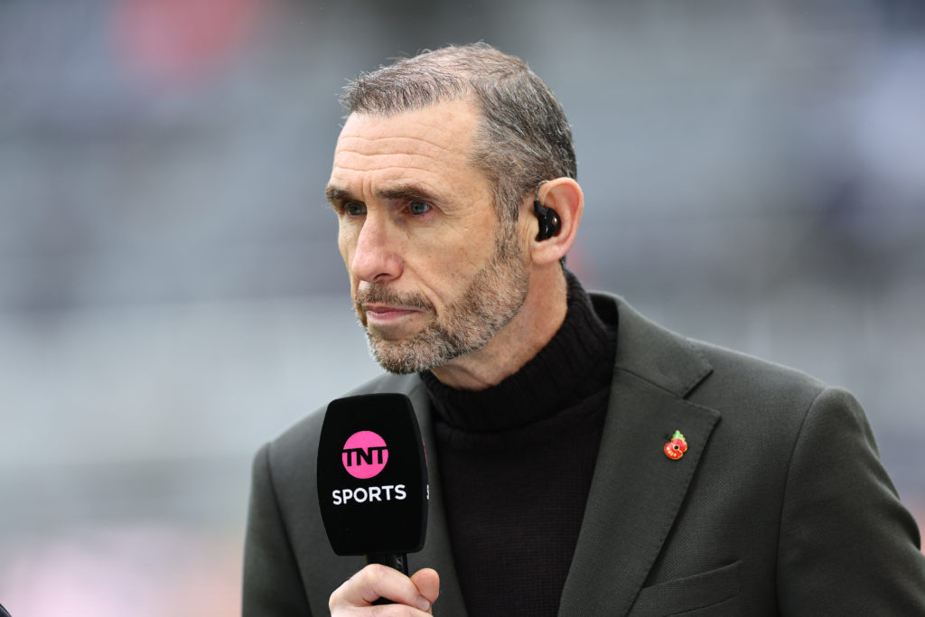 Martin Keown with a TNT Sports microphone in his hand during Newcastle United v Arsenal.