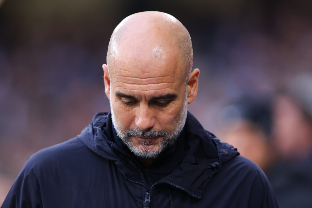 Pep Guardiola looks dejected during the Premier League match between Manchester City and Liverpool.