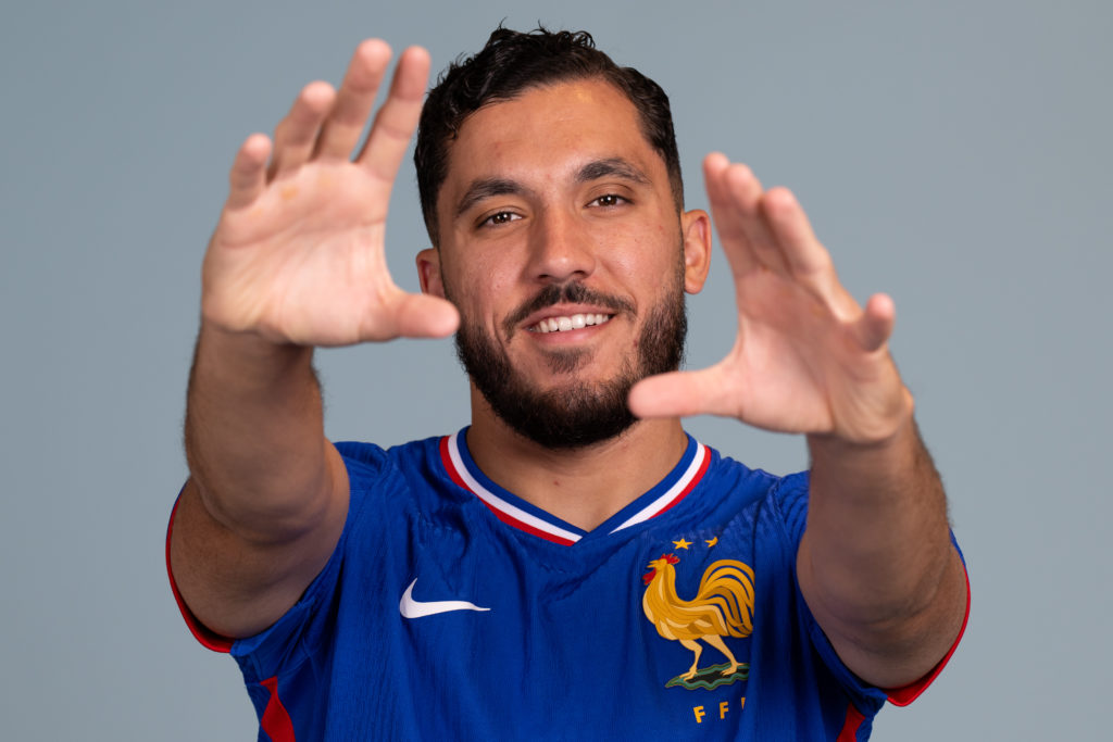 Rayan Cherki poses for a photoshoot with France.