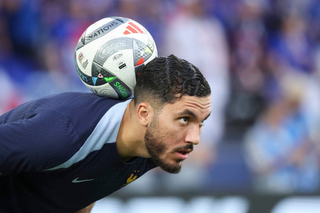 Rayan Cheri with a ball on his neck ahead of Spain v France