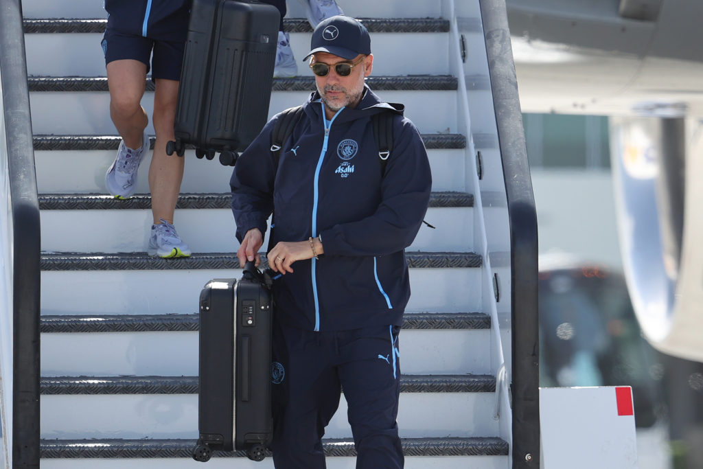 Pep Guardiola gets off the plane for the FIFA Club World Cup.