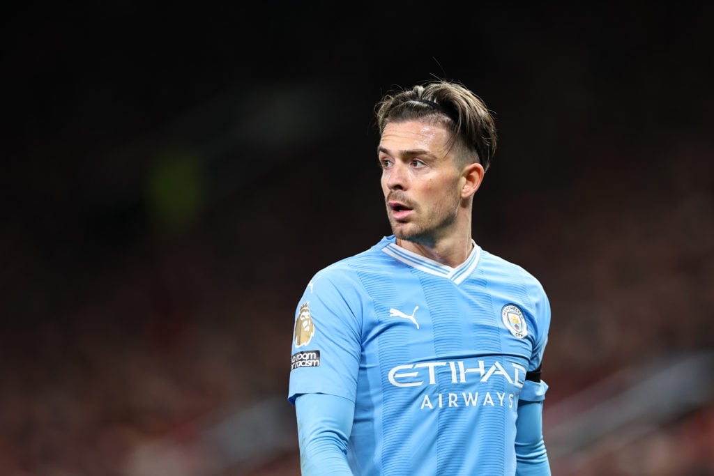 Jack Grealish looks on while playing for Manchester City.