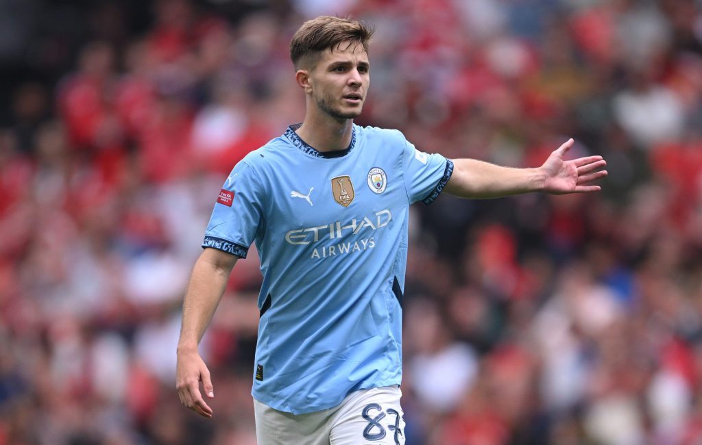 James McAtee in action during Manchester United v Manchester City.