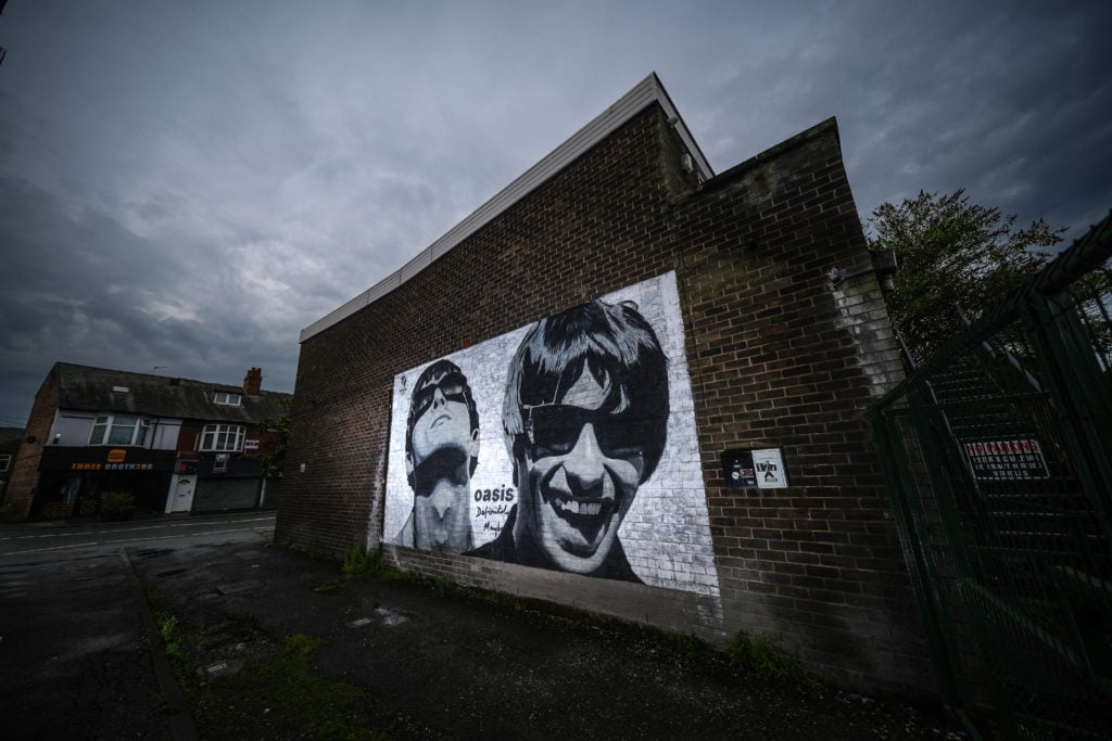 Oasis mural in Manchester after Oasis announced reunion gigs for 2025