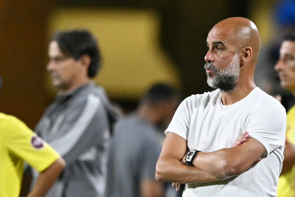 Pep Guardiola and Simone Inzaghi standing on the touchline during Al-Hilal vs Manchester City