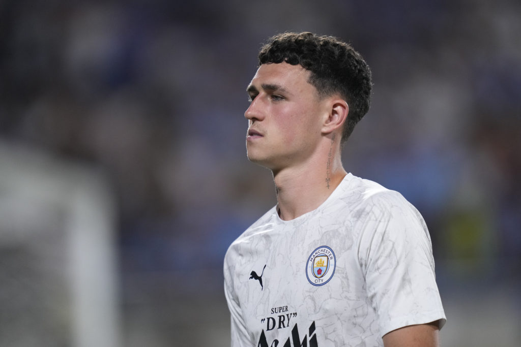 Phil Foden warming up for Manchester City.