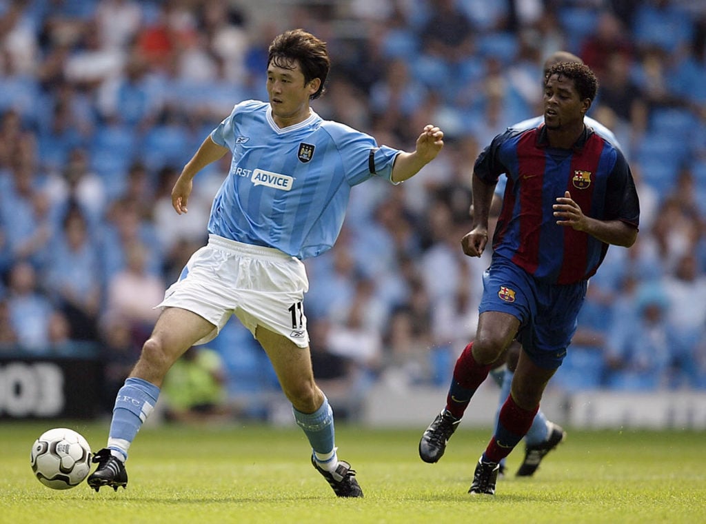 Manchester City midfielder Sun Jihai in action against Barcelona