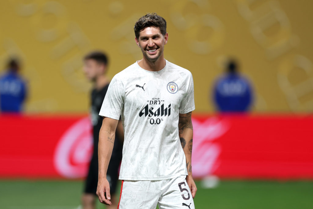 John Stones warms up ahead of Manchester City v Al Ain.