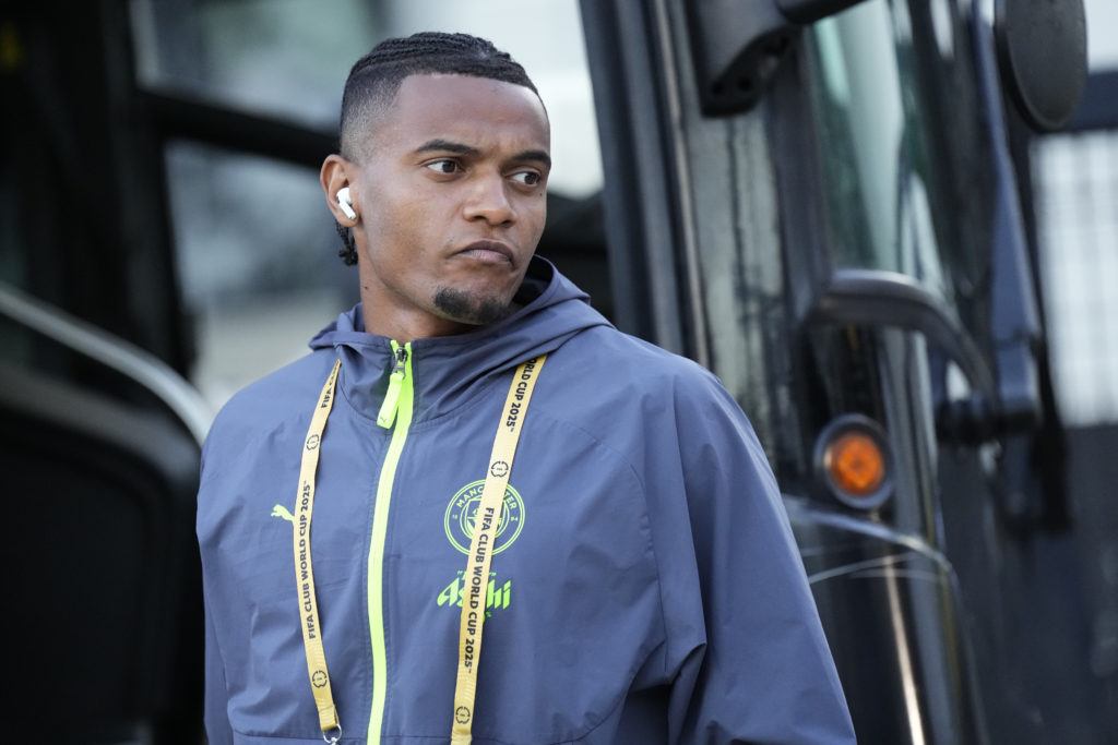 Manuel Akanji stepping off the Manchester City team bus.
